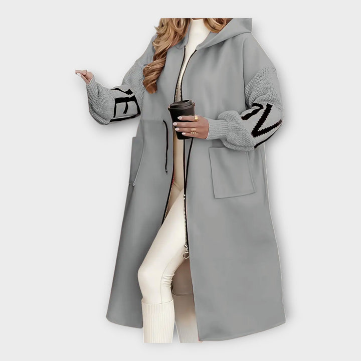 Elegant Lang Frakke med Moderne Detaljer