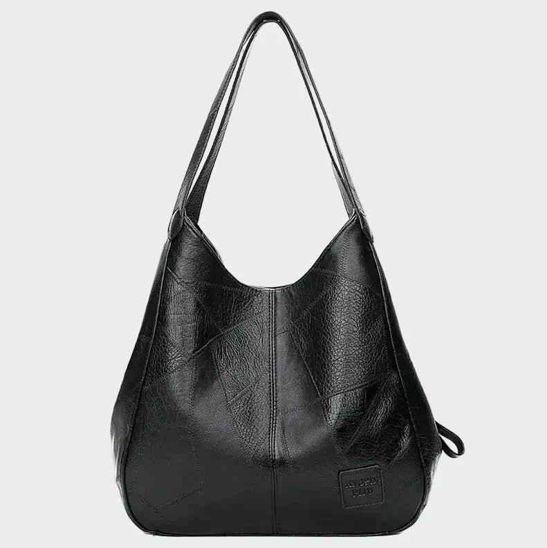 Tidløs læderhåndbagage