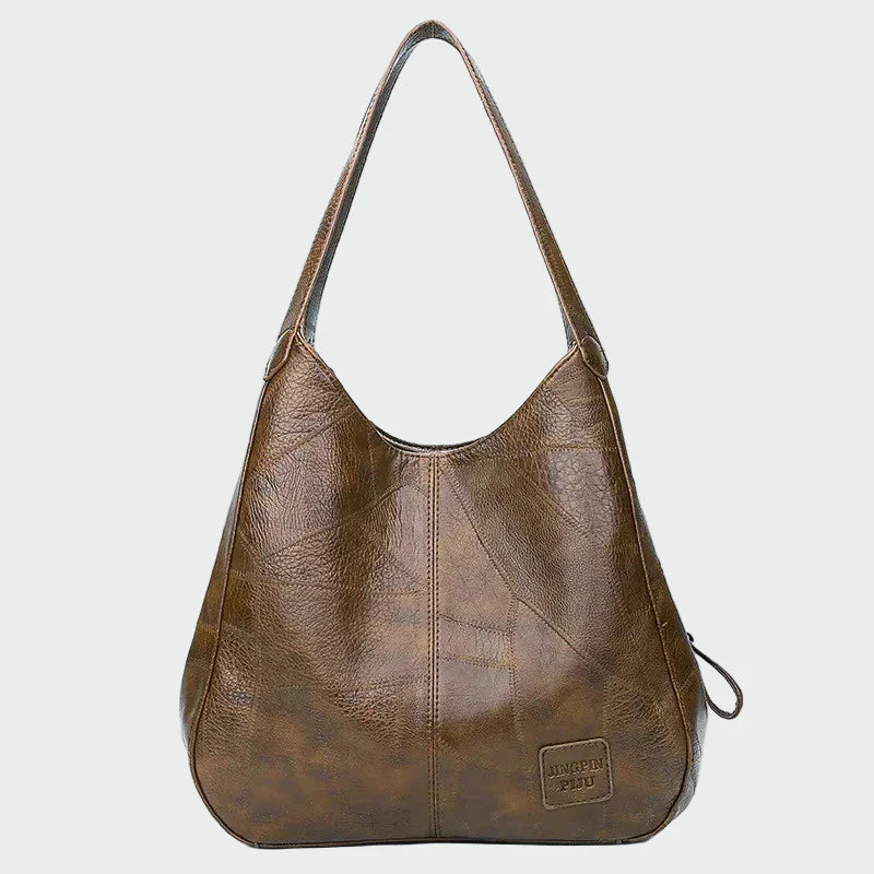 Tidløs læderhåndbagage
